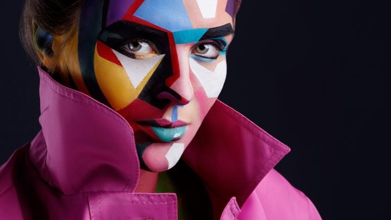 Model with a creative pop art makeup on her face. Model with a creative pop art makeup on her face.